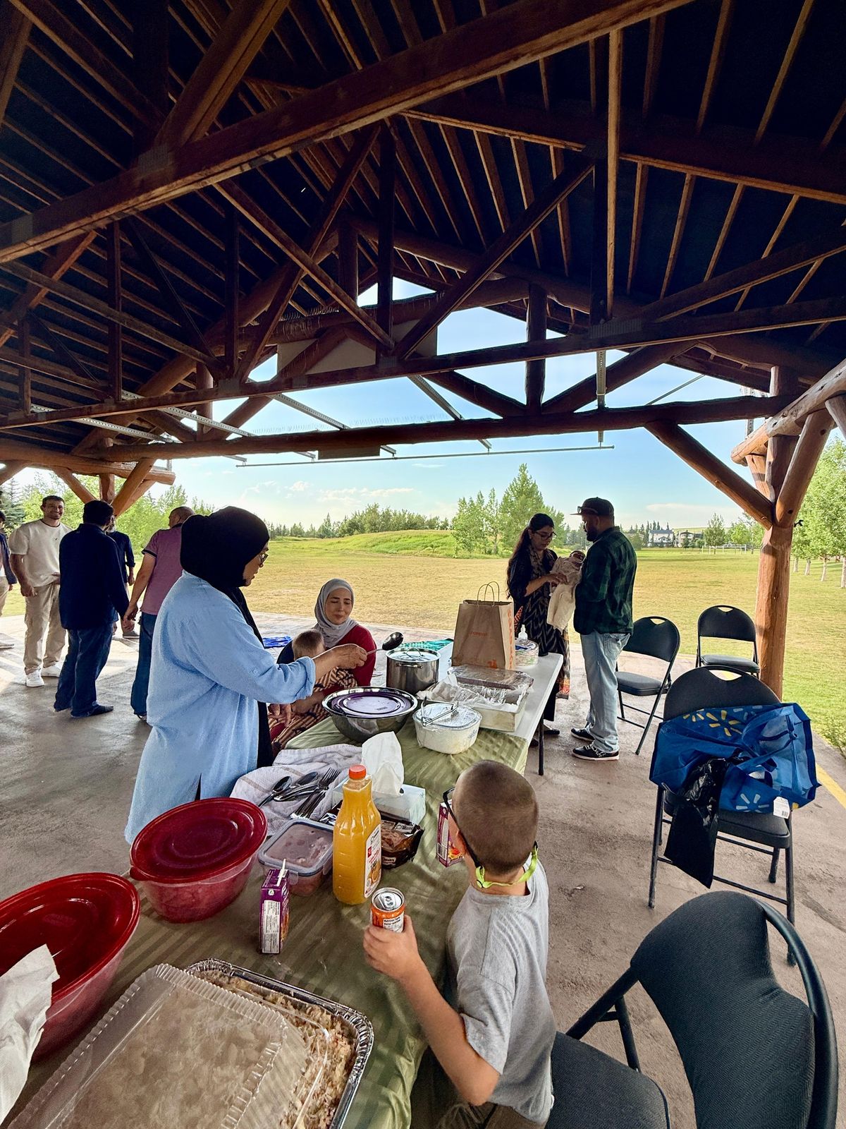 Muslims of Cochrane families enjoying an outdoor picnic